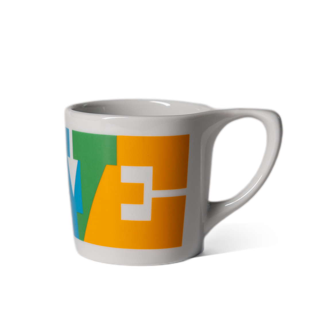 Colour of Love Mug — ceramic, multicolor geometric LOVE pattern