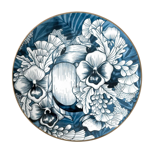 Decorative plate with blue and white floral design on a white background