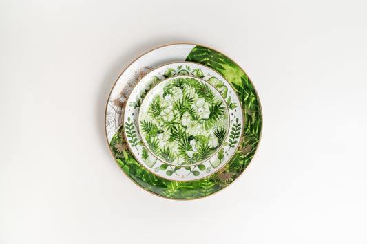 Decorative plate with floral and leaf pattern on a white background