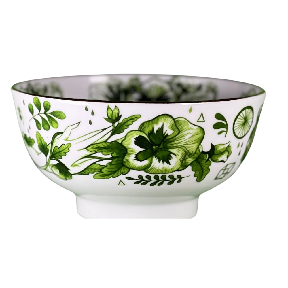 Ceramic bowl with green floral design on a white background