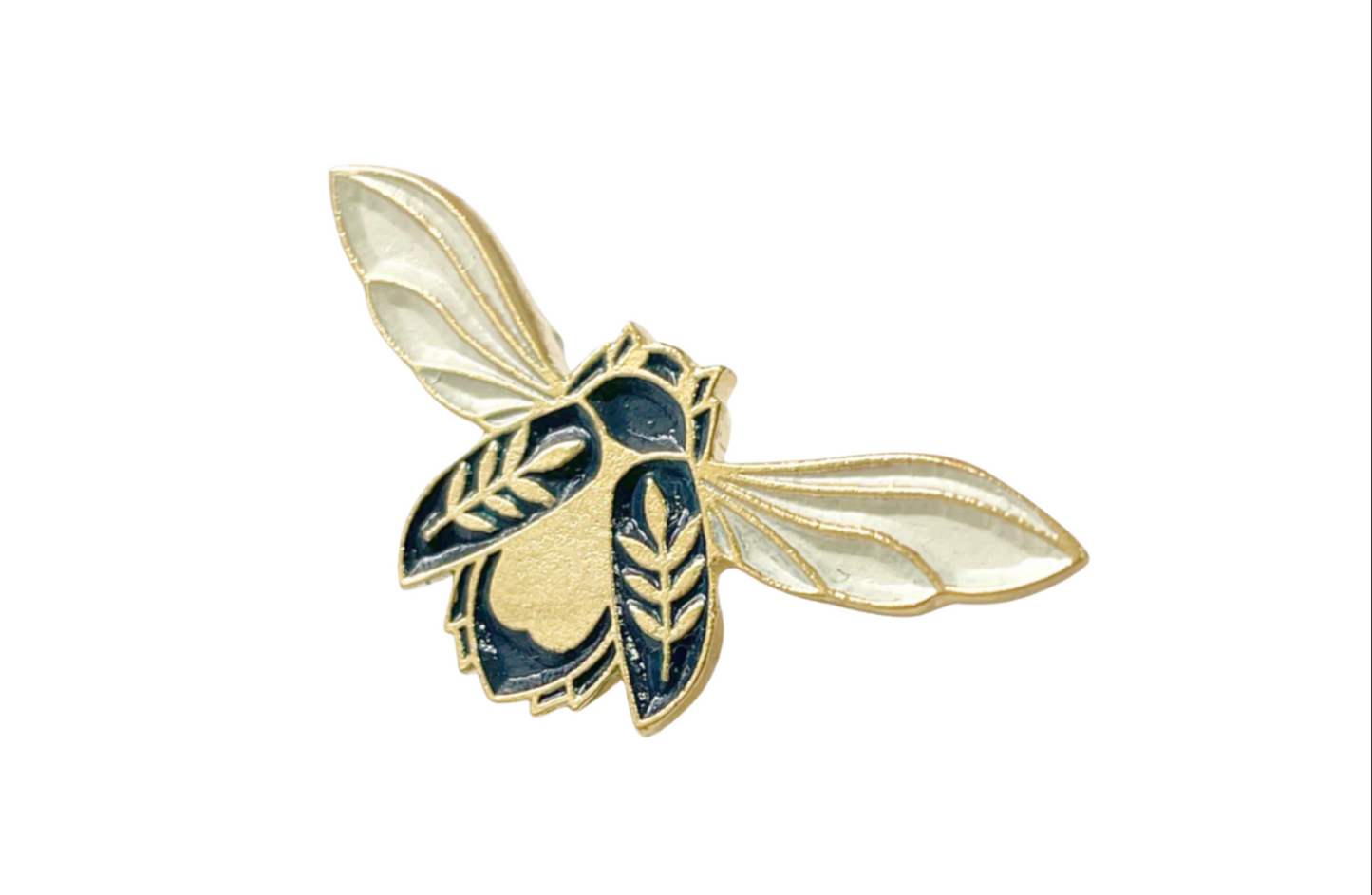 A pin with a design resembling a stylized insect or creature, primarily in gold and black colors.