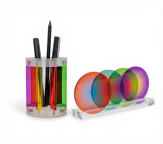 Colorful acrylic pen holder with multicolored circular coasters on a white background