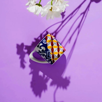 Colorful mug with geometric pattern on a purple background