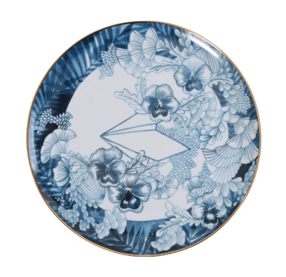 A round ceramic dinner plate with a blue floral pattern and a gold rim.