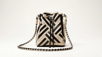 Zebra-patterned handbag with a chain strap on a light beige background