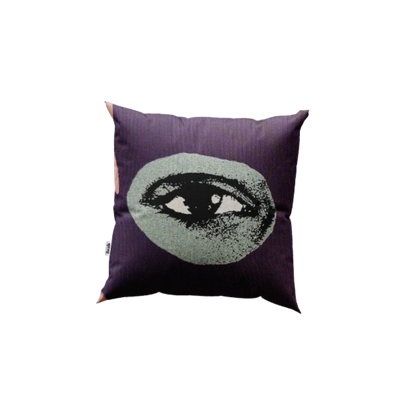 Decorative pillow with eye design on a white background