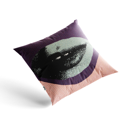 Decorative pillow with a black and white design on a purple background
