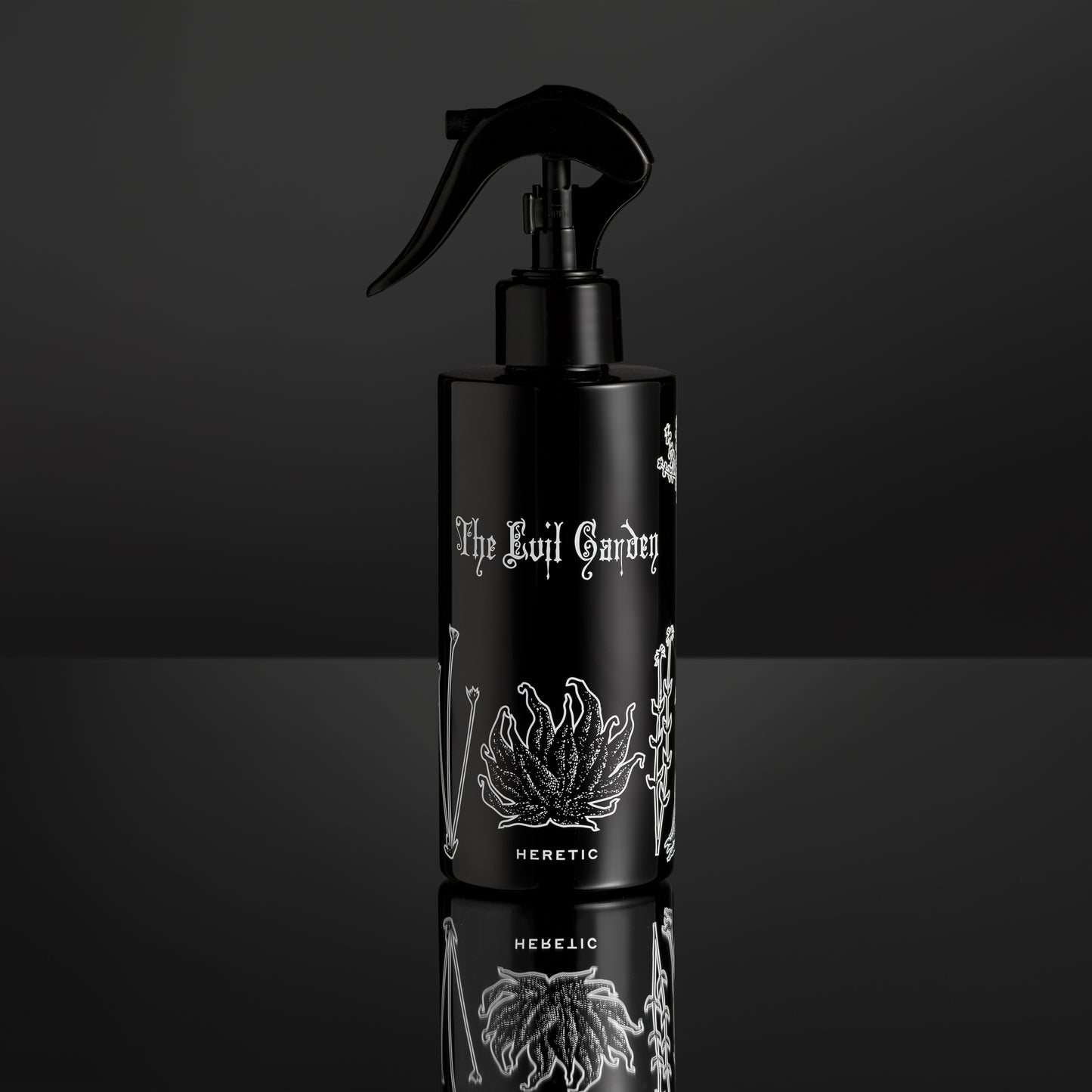 Black spray bottle with white text and design on a black background