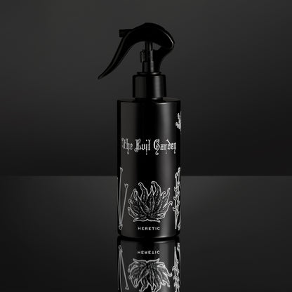 Black spray bottle with white text and design on a black background