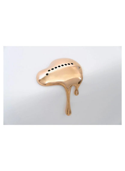 Rose gold ring with a unique design on a white background