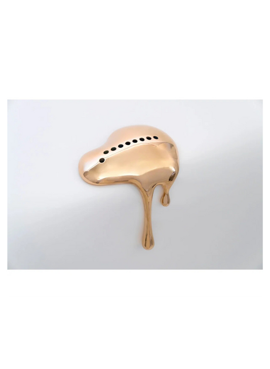 Rose gold ring with a unique design on a white background