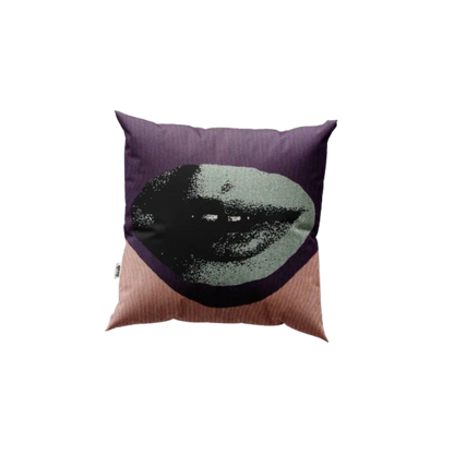 Decorative pillow with a face design on a white background