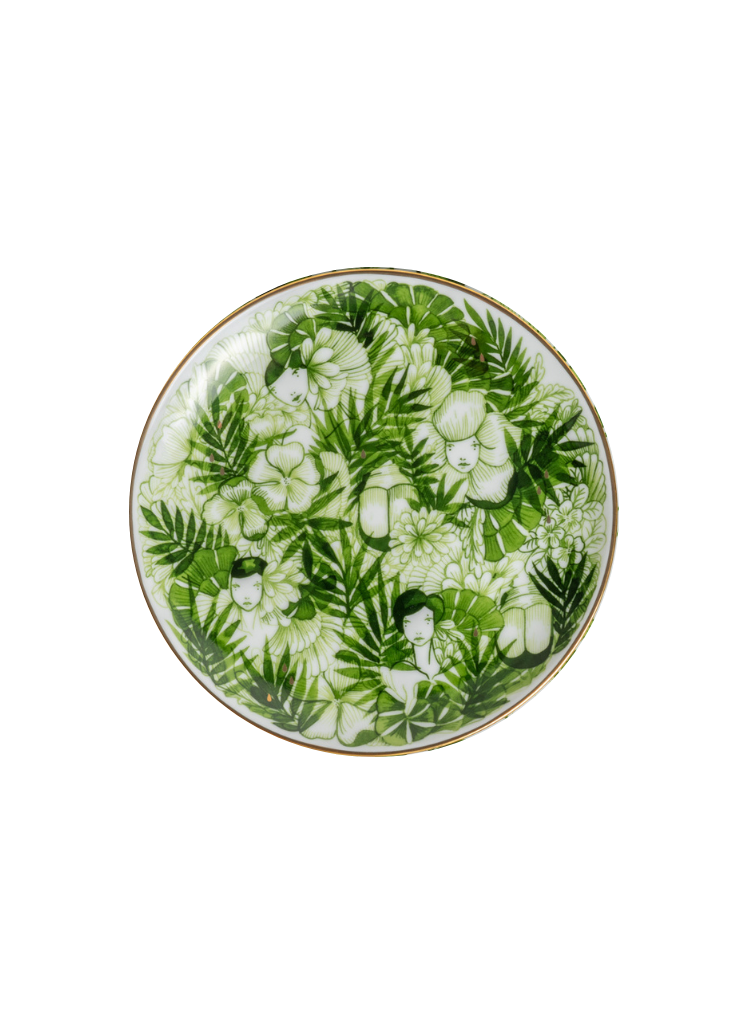 Decorative plate with green leaf pattern on a white background