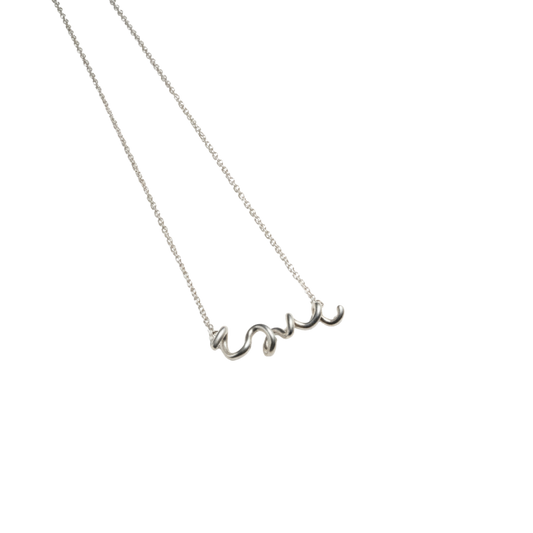 Silver necklace with 'love' pendant on a white background