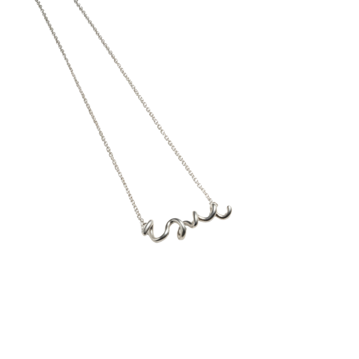 Silver necklace with 'love' pendant on a white background