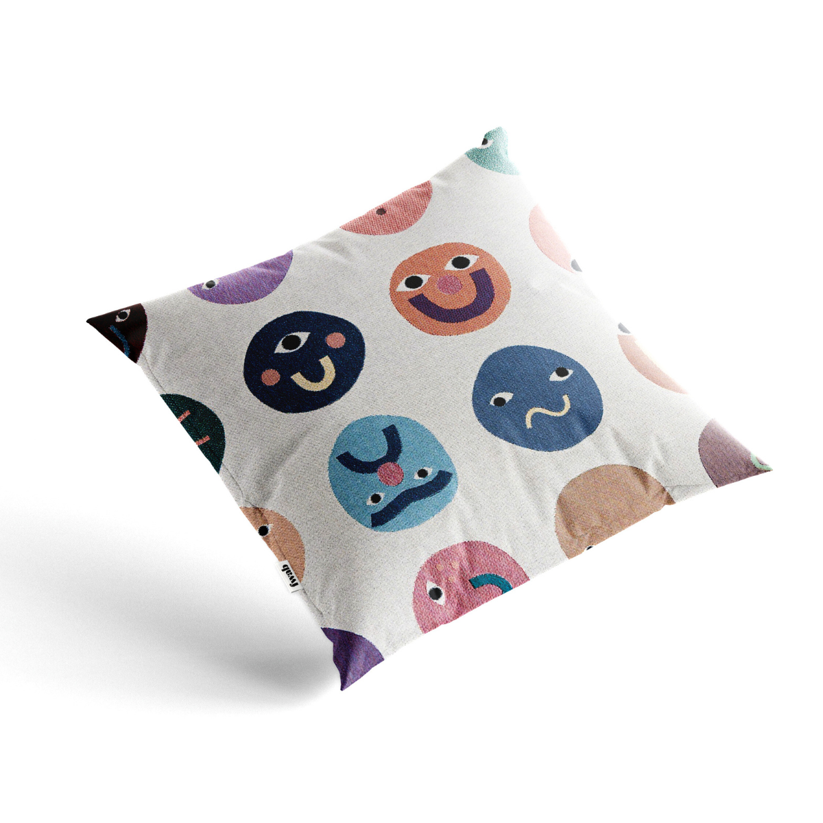 Decorative pillow with colorful smiley face patterns on a white background