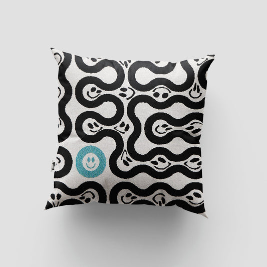 Decorative pillow with black wavy pattern and blue smiley face on a light gray background