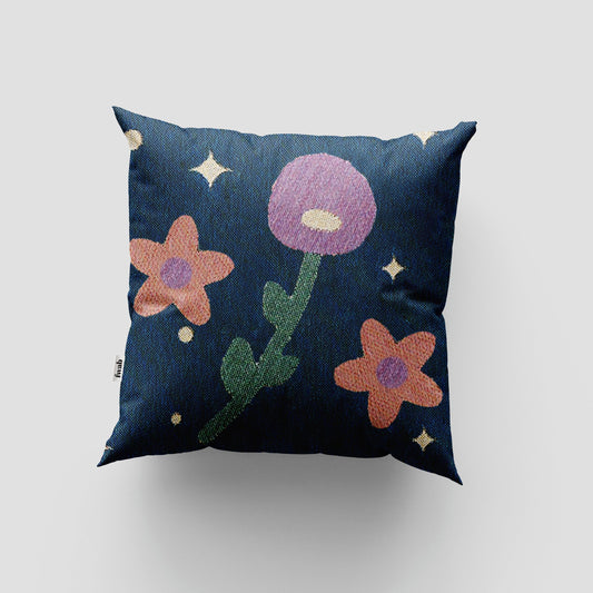 Decorative pillow with floral design on a plain background