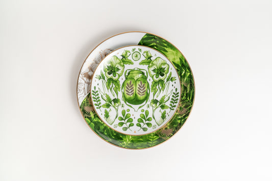 Decorative plate with green floral design on a white background