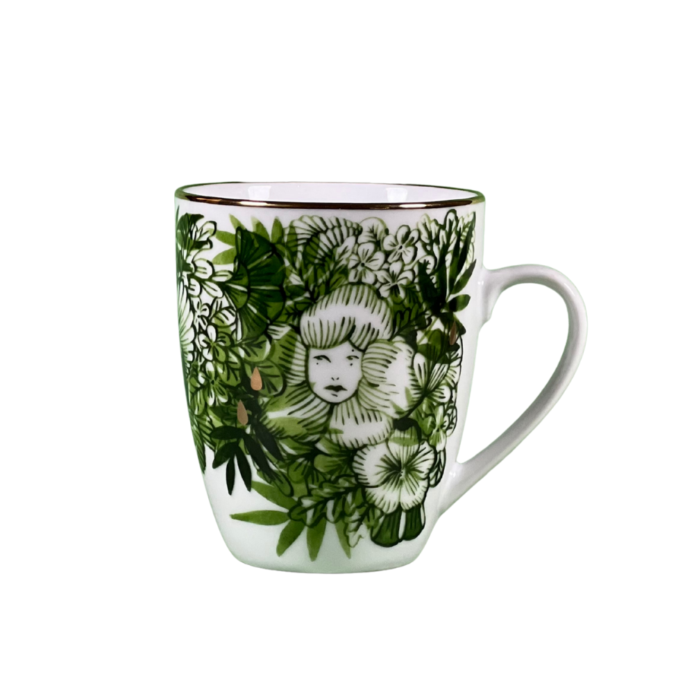 Mug with floral and face design on a white background