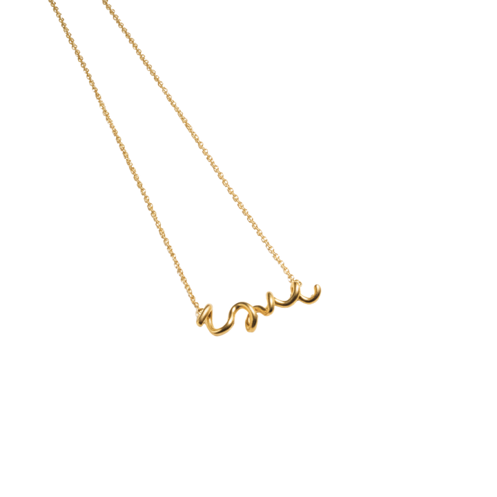 Gold necklace with 'love' pendant on a white background