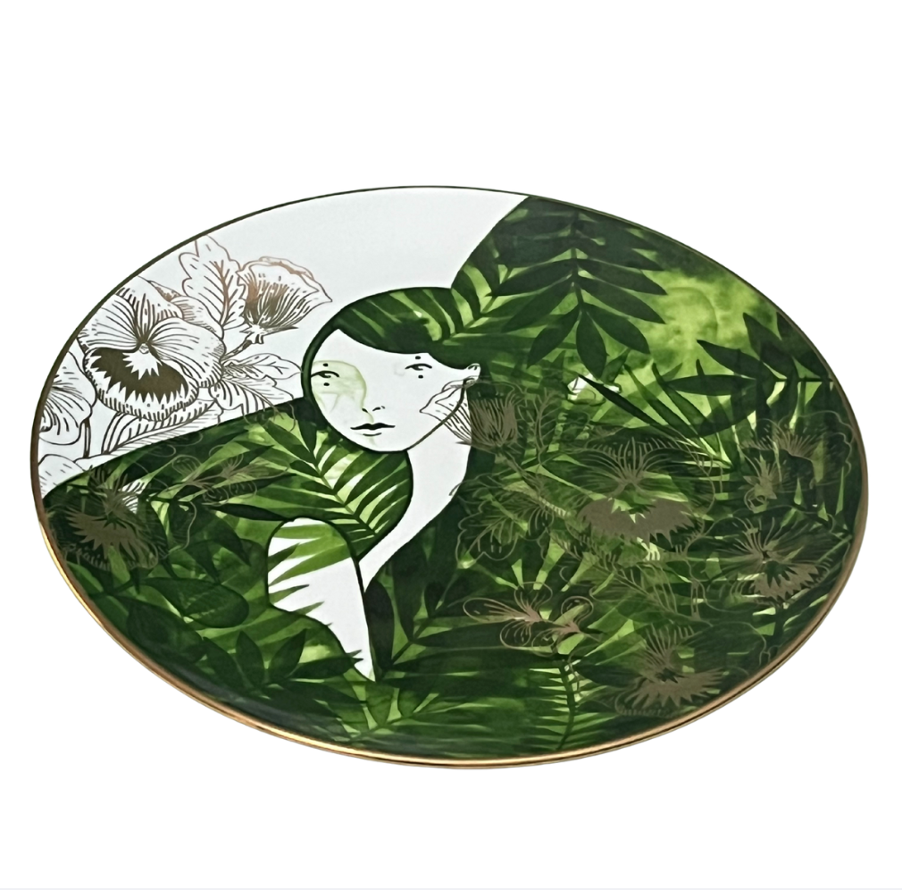 Decorative plate with artistic design of a woman and nature elements on a white background