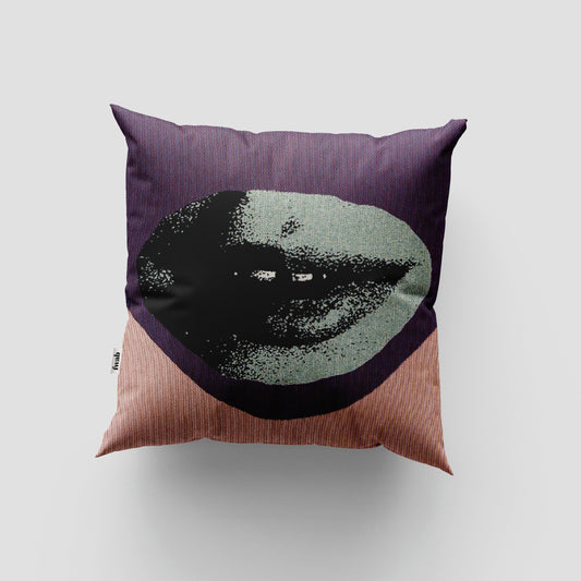 Decorative pillow with a face design on a plain background